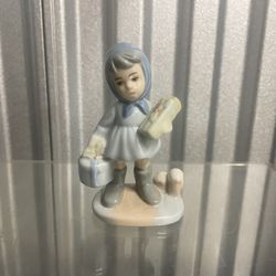 Porcelain Figurine of Girl with Gifts