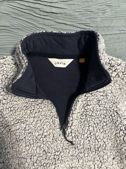 Warm sherpa fleece pullover with a zip collar. Ideal for cool weath