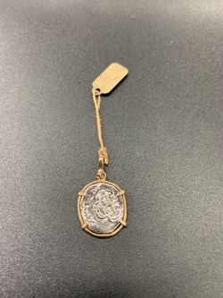Atocha silver coin pendant in gold bezel