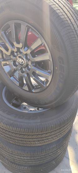 New Toyota rims with nearly new Yokohama brand tires