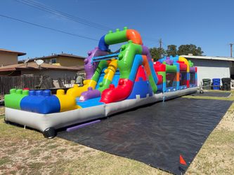 Obstacle course with slide and pit balls or water