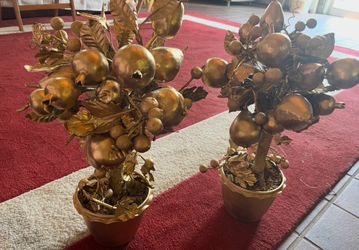 Two gold fruity topiary trees