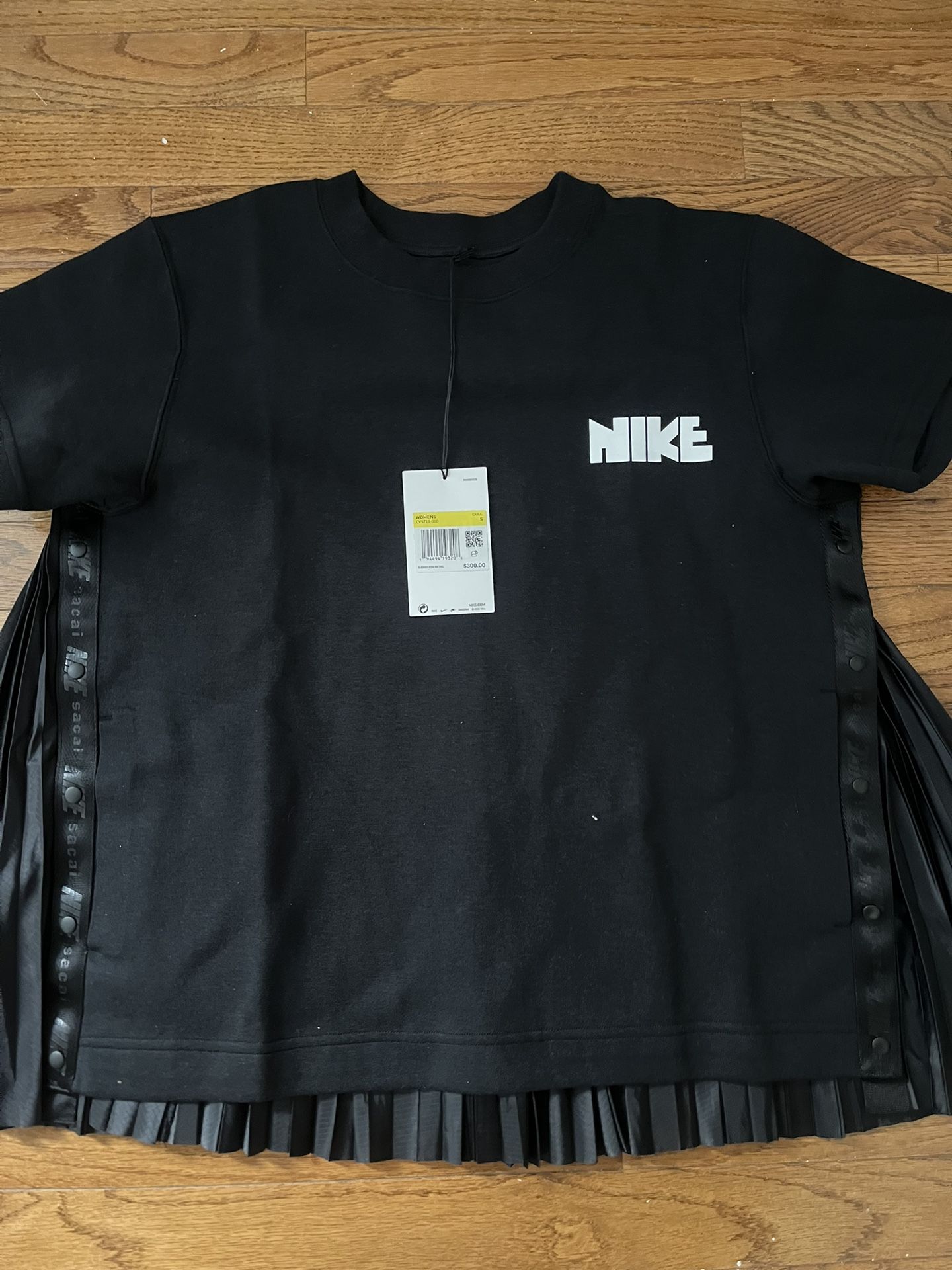 brand new Nike x Sacai short sleeve top in black, size small