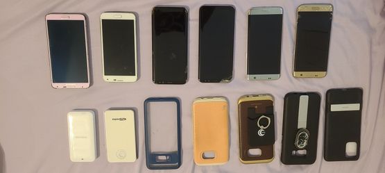 6 SAMSUNG Cell Phones And 2 Portable Chargers And 1 VR Headset.
