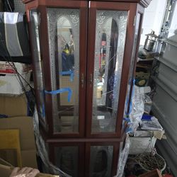 Curious Cabinet With Broken Glass In Top Part