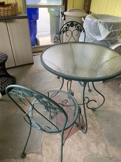 VINTAGE  wrought iron table & two chairs vintage With Original Patina. Local Pick Up Only.