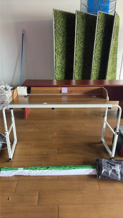 Adjustable table with power cables