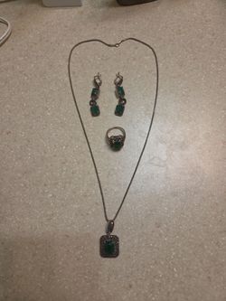 Sterling Silver jewelry set. Includes necklace with pendant, earrings and the ring. Total weight is 29.7 grams