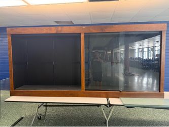 Wood cabinets with glass shelves.