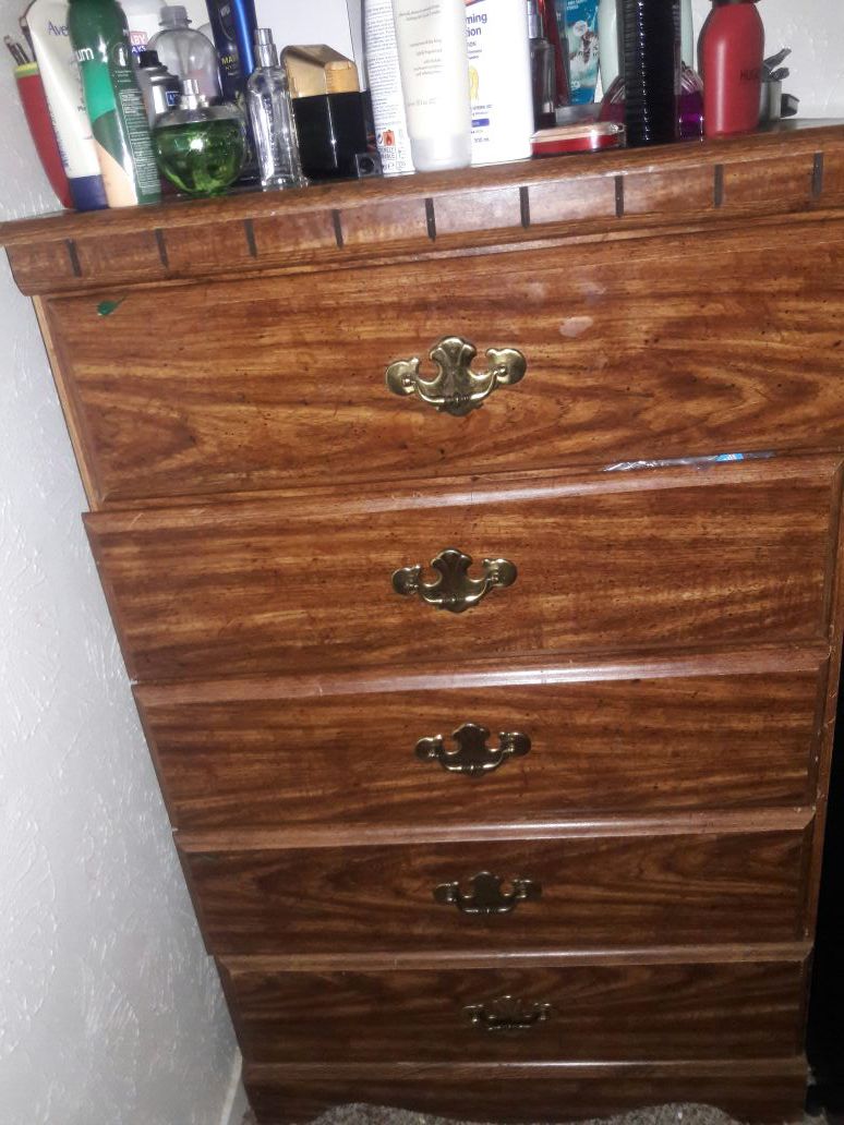 Solid wood tall dresser with 5 drawers.