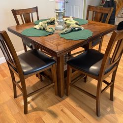Opens to round too 5-pc. Bar Height Dining Set