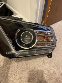 Stock OEM 2013 Boss 302 Projector Headlights.