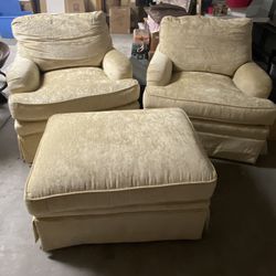 Two Swivel Chairs And An Ottoman