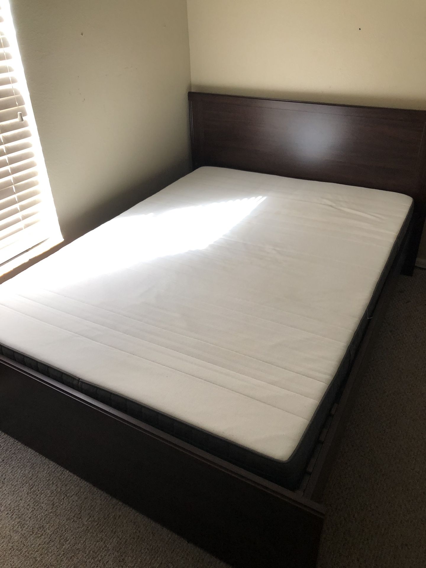 IKEA bed frame and mattress.