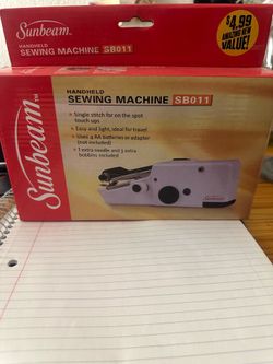 Handheld sewing machine