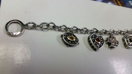 .925 sterling silver braclet.....with real gemstones........14 kt. Gold overlay