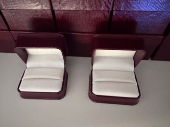 Burgundy double ring boxes.