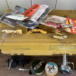 Vintage large Plano tackle box with vintage lures and fishing gear reels