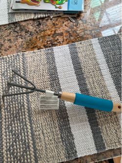 Garden Bloom 551BL cushion grip cultivator with a blue handle.