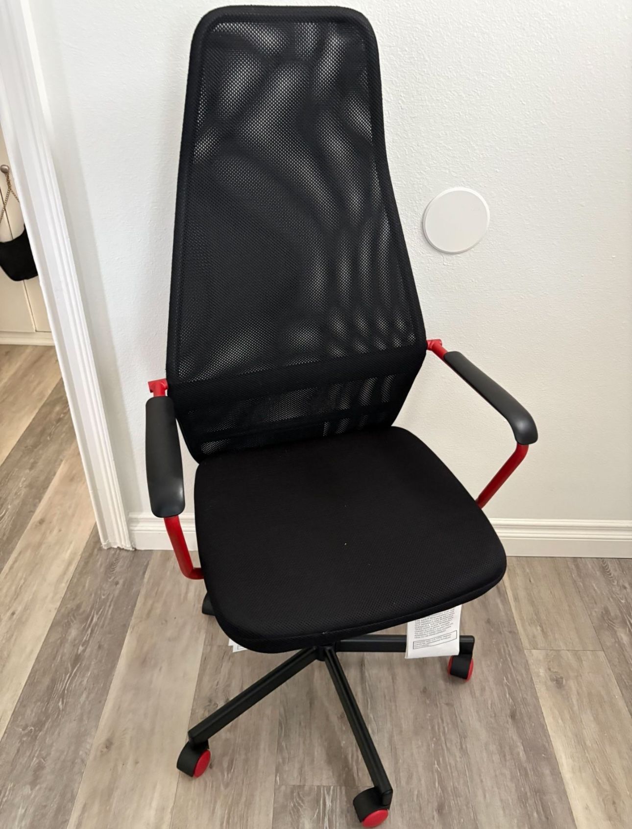 Black Mesh Chair With Red Accents 