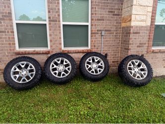 20” OEM snowflake wheels with 35” mud tires