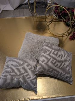 Three beautiful gray accent pillows