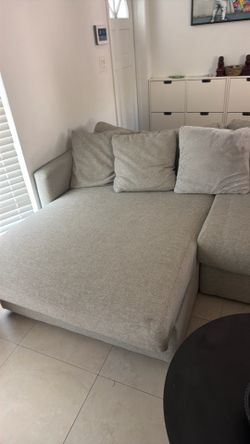 Sofa couch with a chaser on the right