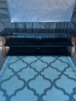 Black glass and wood tv stand
