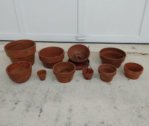 Preowned bunch of clay flower pots for orchids