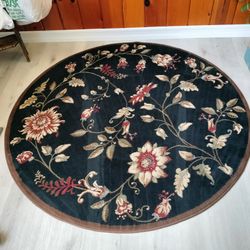 2 Black and Floral Rugs