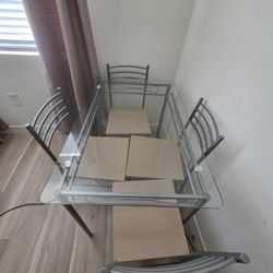 Glass Table. Four Chairs