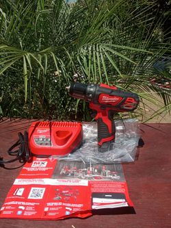 Milwaukee 12 v  New Drill drive.   W  Battery. Charger