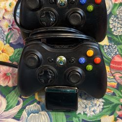 2 XBOX 360 Controllers And Docking Systems 