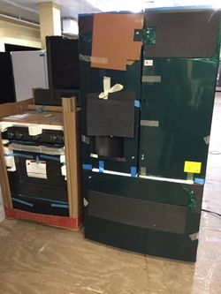 GE Black slate set 36” French Door Refrigerator with showcase and 5 Burner conv Oven Gas Range