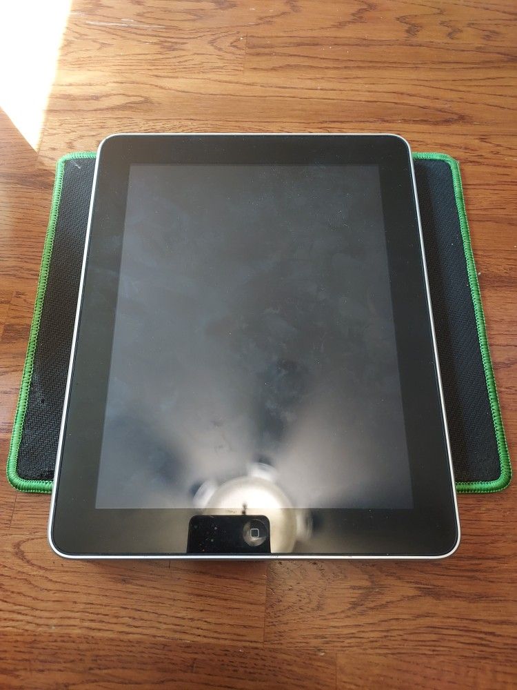 Apple iPad, specifically a 1st generation model with 16GB storage capacity.