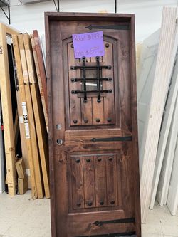 Rustic Wood Entry Door with Iron Speakeasy Grill