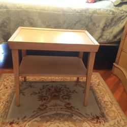 Small table framed top with shelf underneath. Great condition.
