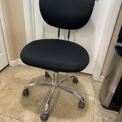 black / chrome office desk chair with pneumatic adjustment lever