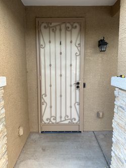 Wrought Iron Gates And Wood Slats 