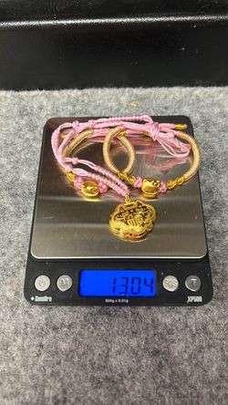 24k yellow gold on silk chord bracelets and necklace