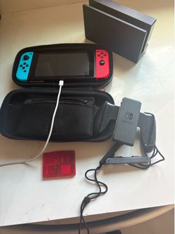 nintendo switch with 3 games, tv plug in and extra side add ons