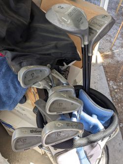 Set of Wilson golf clubs with bag & ball
