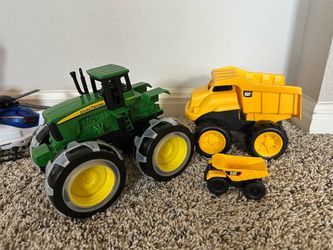 John Deere tractor and CAT Trucks