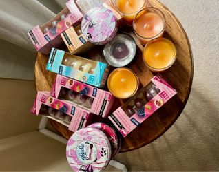 Bunch of unused candles and refills