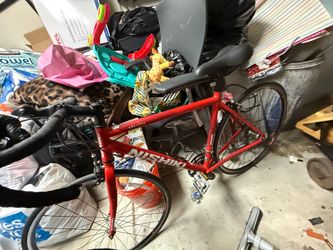 red Nishiki Maricopa road bike with an aluminum frame. 23 is the frame size. 27 is the wheels.