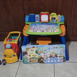 VTech Explore & Write Activity Desk for kids
/ Fisher-Price Little People Big ABC Animal Train, Push-Along Toy Vehicle with Lights and Music