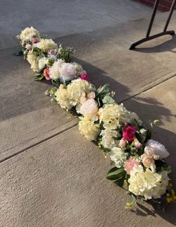 Faux flowers and floral table runners