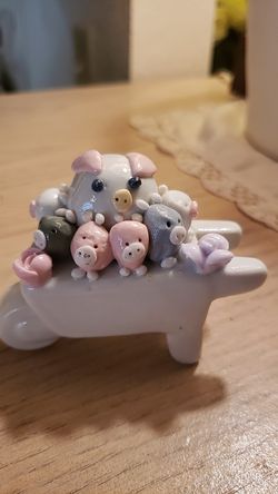 Wheelbarrow with pig and piglets
