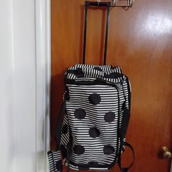 Carry On Luggage.  All Zippers Work.  Some Wear On The Bottom.  See Photos 