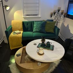 Green sofa, yellow throw, coffee table, blue art painting and rug combo for sale